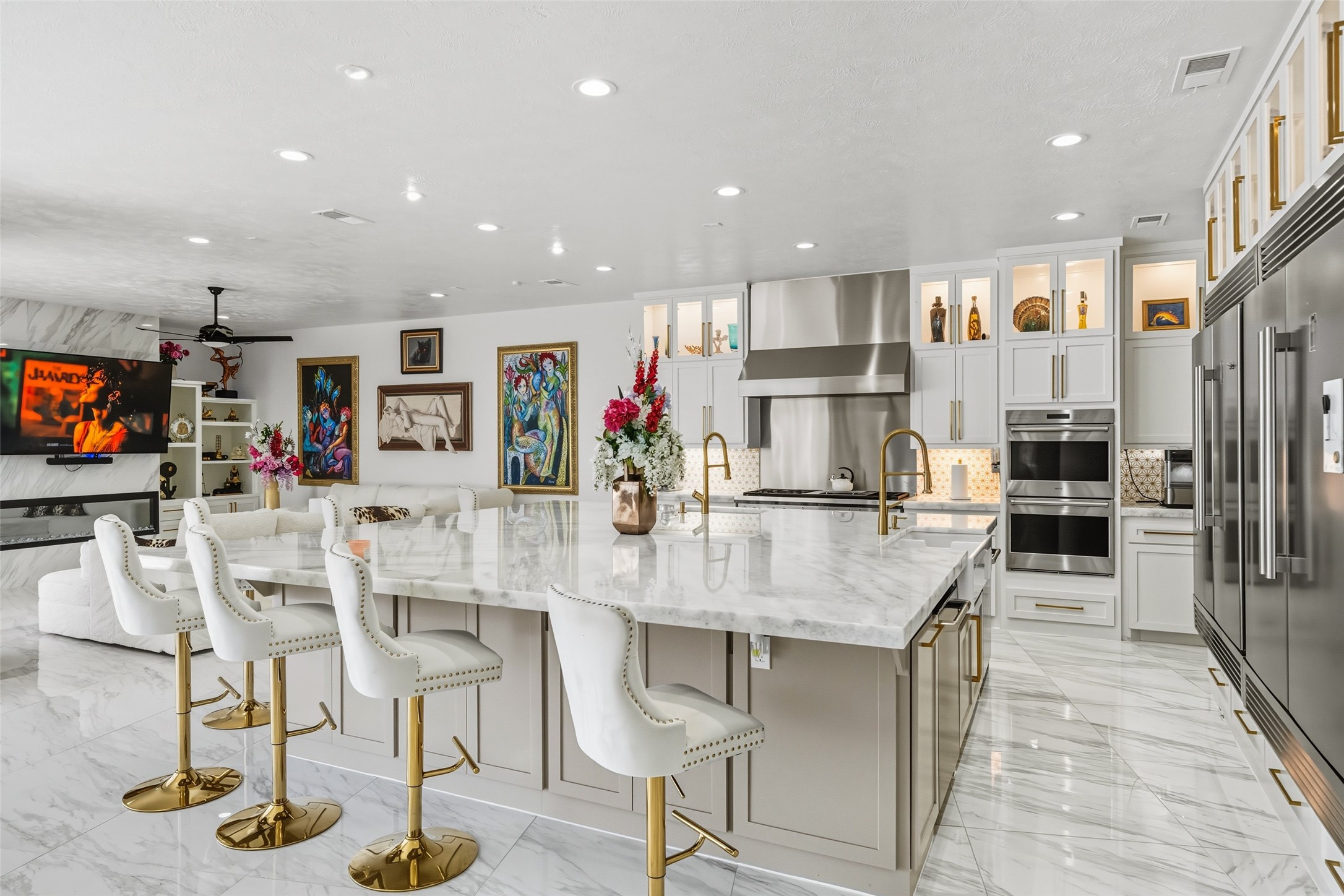 2500 Sand Shore Drive Conroe, TX 77304 - Photo 17 of 50 a kitchen with stainless steel appliances kitchen island granite countertop a table and chairs in it