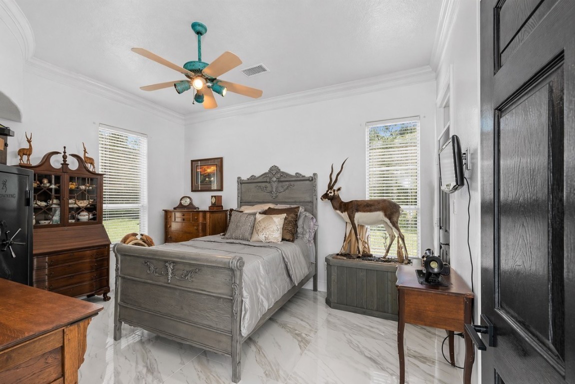 2500 Sand Shore Drive Conroe, TX 77304 - Photo 27 of 50 a bedroom with a bed and wooden floor