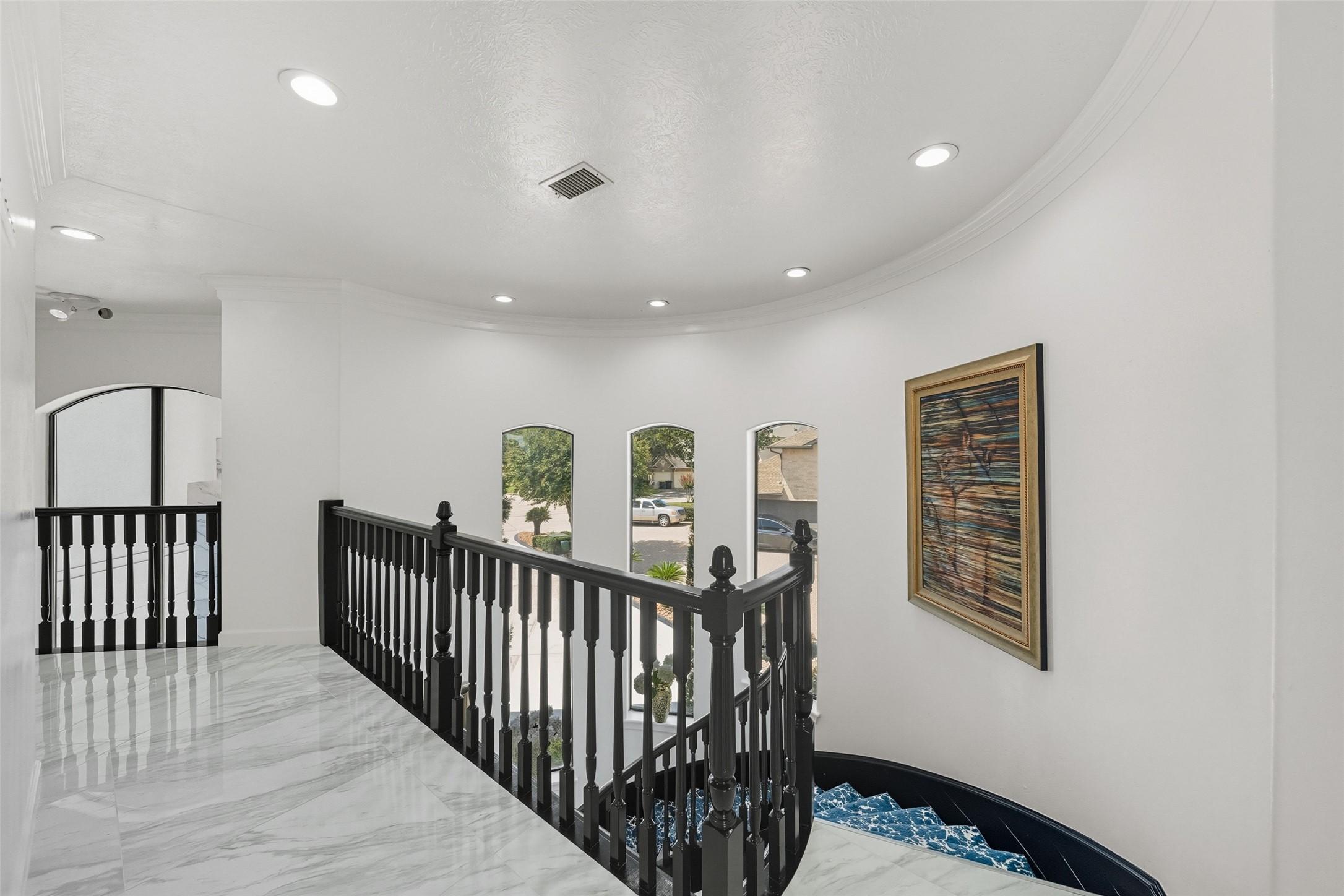 2500 Sand Shore Drive Conroe, TX 77304 - Photo 29 of 50 The landing at the second level is appointed with marble flooring.