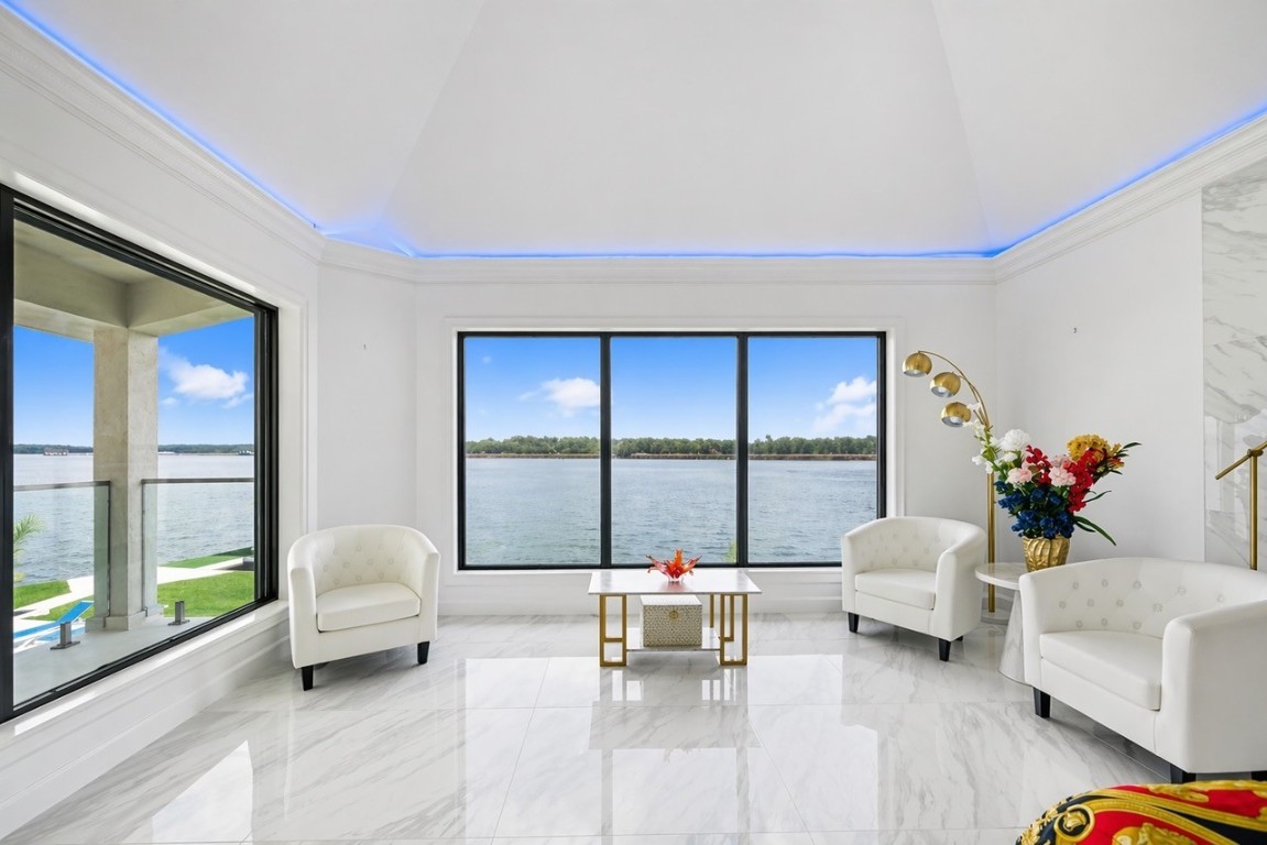2500 Sand Shore Drive Conroe, TX 77304 - Photo 32 of 50 a living room with furniture and a large window with outer view