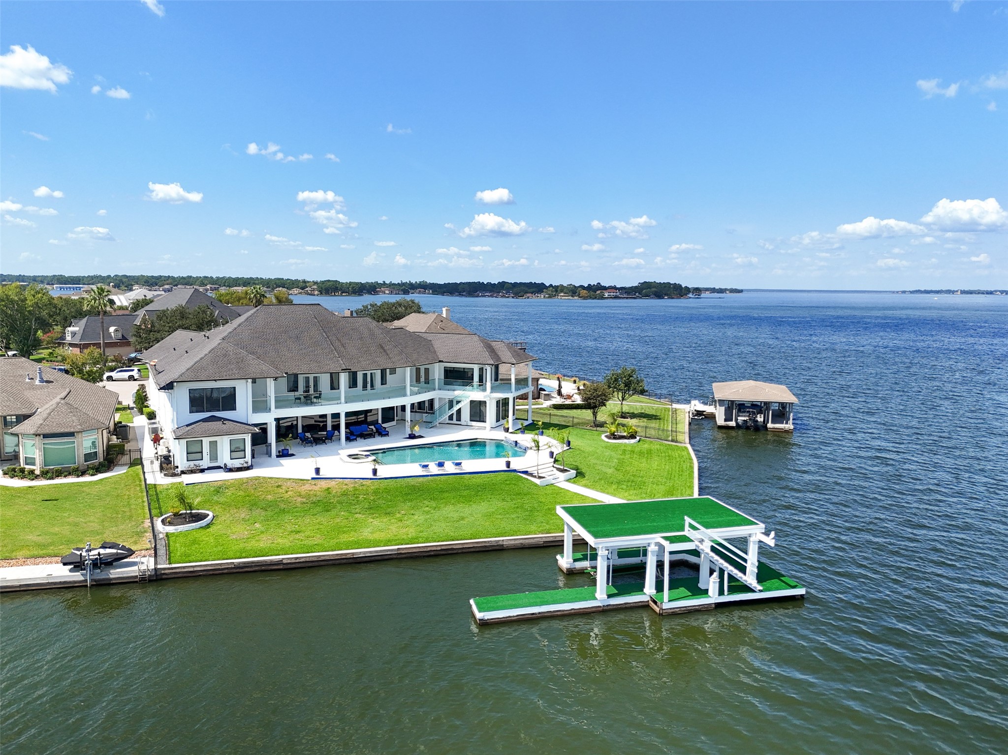 2500 Sand Shore Drive Conroe, TX 77304 - Photo 4 of 50 a view of a house with a backyard patio and swimming pool