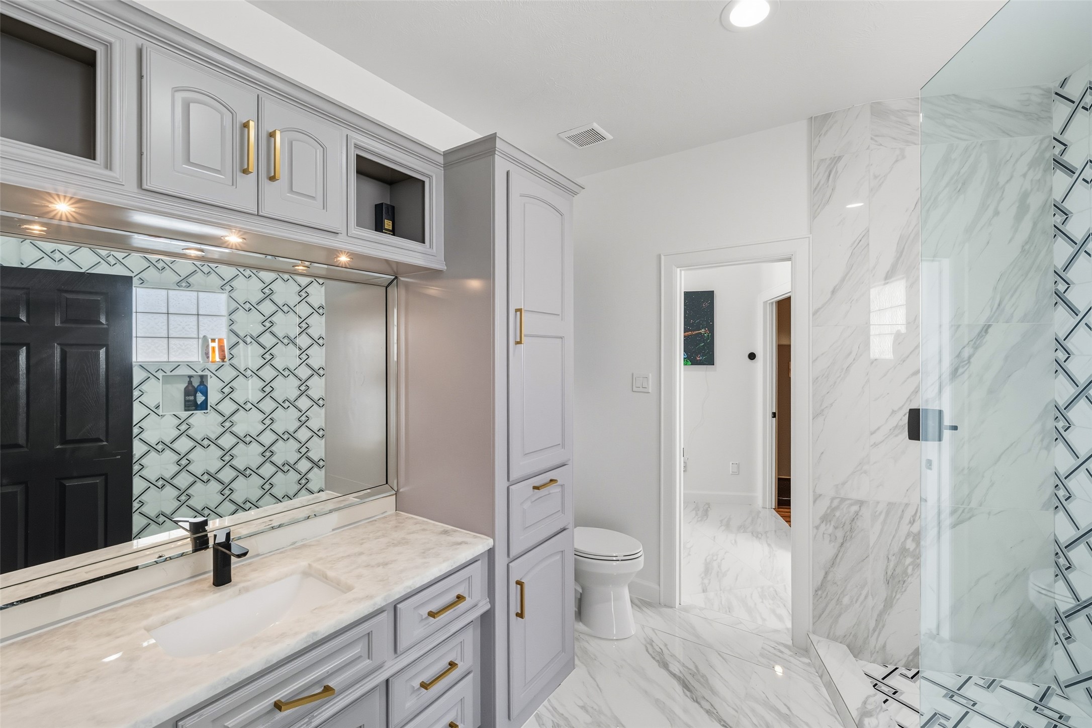 2500 Sand Shore Drive Conroe, TX 77304 - Photo 40 of 50 a bathroom with a sink toilet and shower