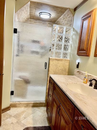 608 Heather Court Ridgecrest, CA 93555 - Photo 16 of 28 a bathroom with a sink and a mirror