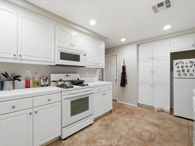 a bathroom with a sink toilet and a mirror