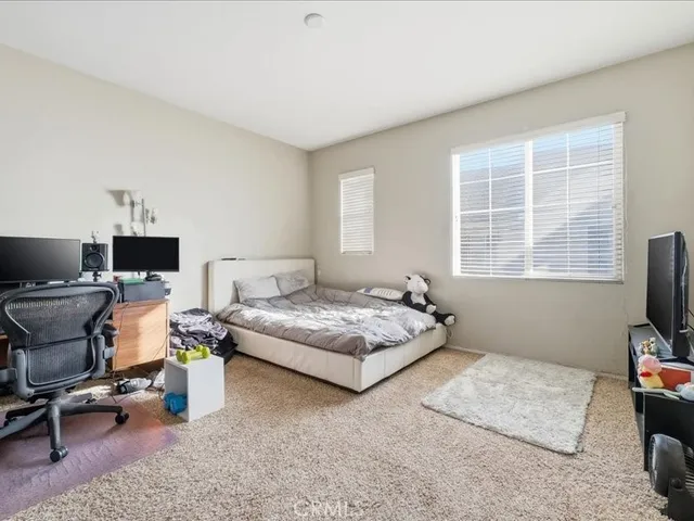 a living room with furniture and a chair