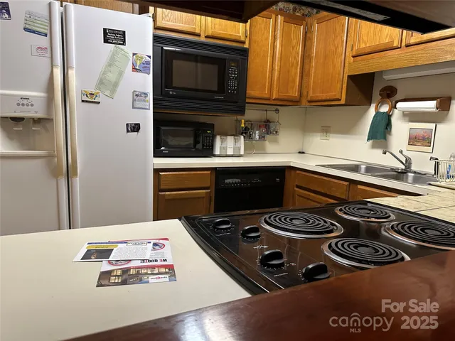 a kitchen with a stove and a sink