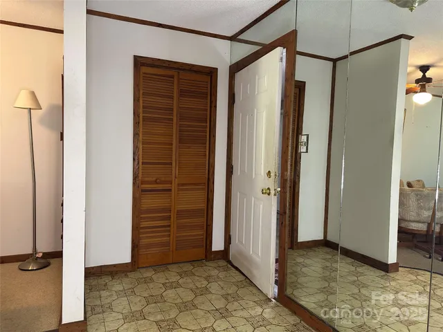 an empty room with an entryway door