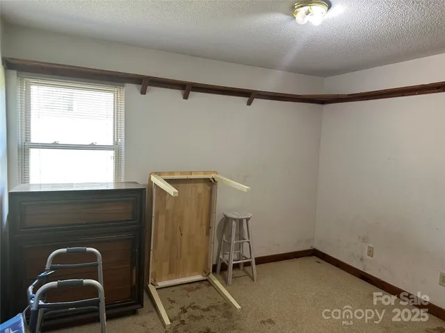 a room with a chair and a window