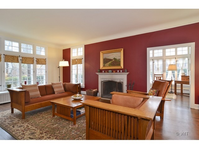 3025 Normandy Place Evanston, IL 60201 - Photo 4 of 24 a living room with furniture a flat screen tv and a fireplace
