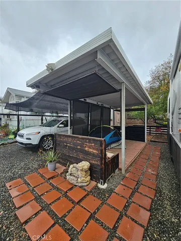 a view of a backyard with sitting area