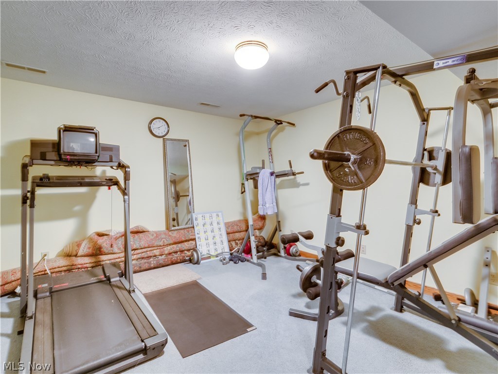 876 Hunter Ridge Circle Fairlawn, OH 44333 - Photo 30 of 35 Exercise anyone? This area adjoining the 5th bedroom has lots of options for you