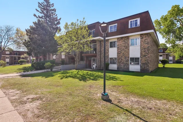 a sign board on the side of the house
