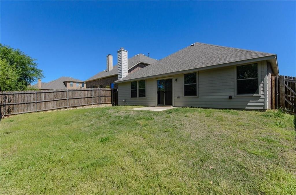 3404 Evening Wind Road Denton, TX 76208 - Photo 23 of 24 a front view of a house with a garden