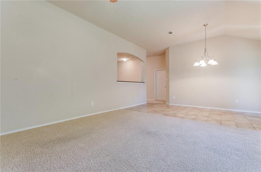 3404 Evening Wind Road Denton, TX 76208 - Photo 9 of 24 a view of an empty room with a window