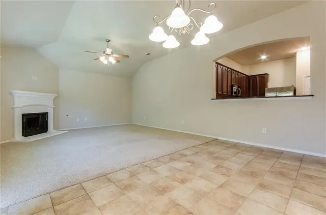 a view of a kitchen with a dishwasher cabinets and a fireplace