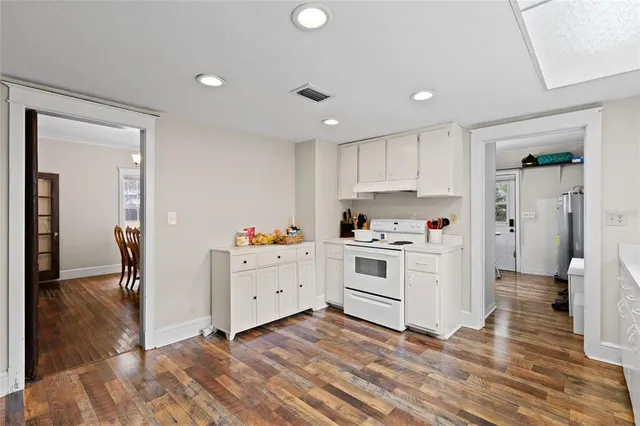 a spacious bathroom with a double vanity sink and a large mirror