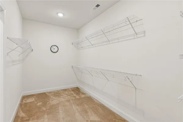 a view of a room with racks on the wall