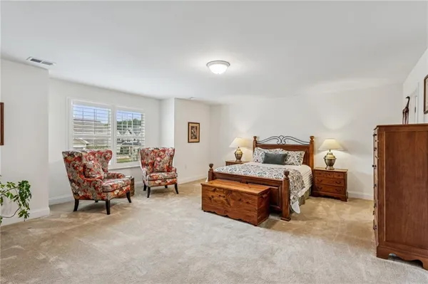 a bed room with furniture and a window