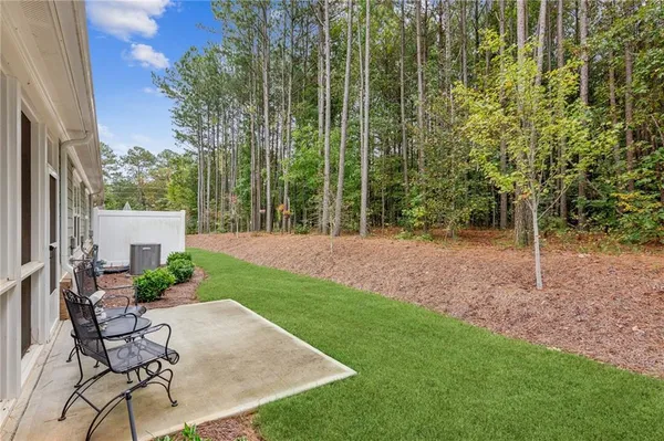a view of yard with patio and outdoor seating
