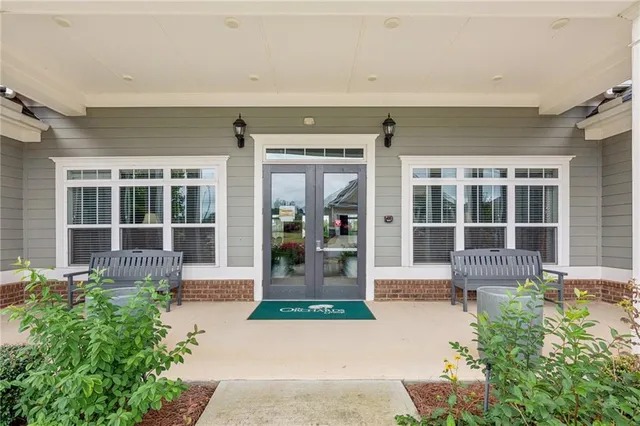a front view of a house with outdoor seating