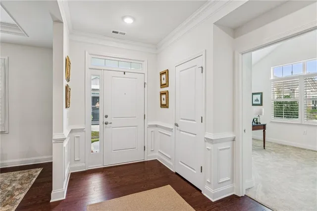 wooden floor with white cabinets and wooden floor