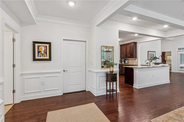a view of kitchen with cabinets and wooden floor