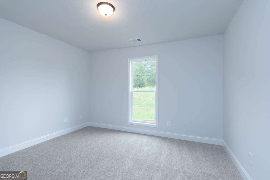 526 Oil Mill Road, Unit 9 Martin, GA 30557 - Photo 15 of 27 an empty room with a window