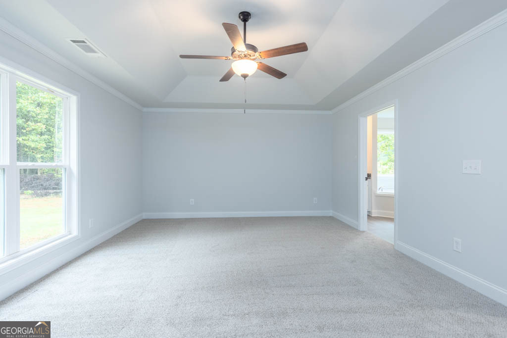 526 Oil Mill Road, Unit 9 Martin, GA 30557 - Photo 18 of 27 an empty room with a window and a ceiling fan