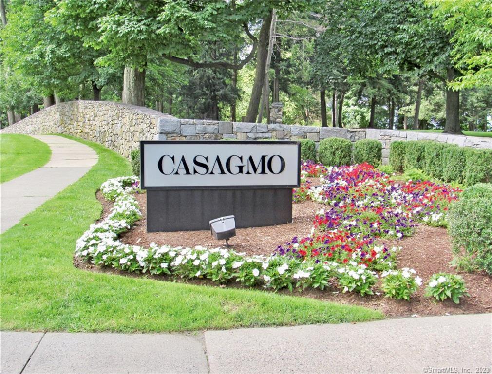 82 Lawson Lane, Unit 82 Ridgefield, CT 06877 - Photo 1 of 1 a sign that is in front of flowers