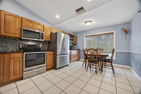 a kitchen with granite countertop cabinets and stainless steel appliances