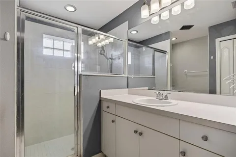 a bathroom with a sink and mirror