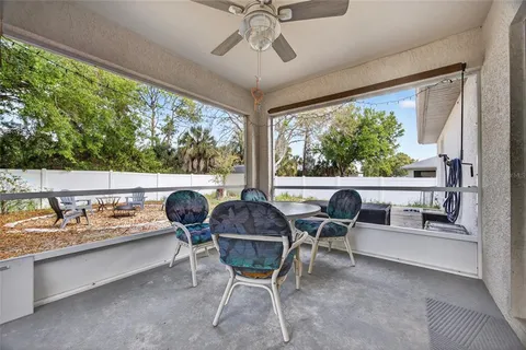 a dining room with furniture and windows