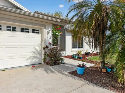 a view of a chair and table in the patio
