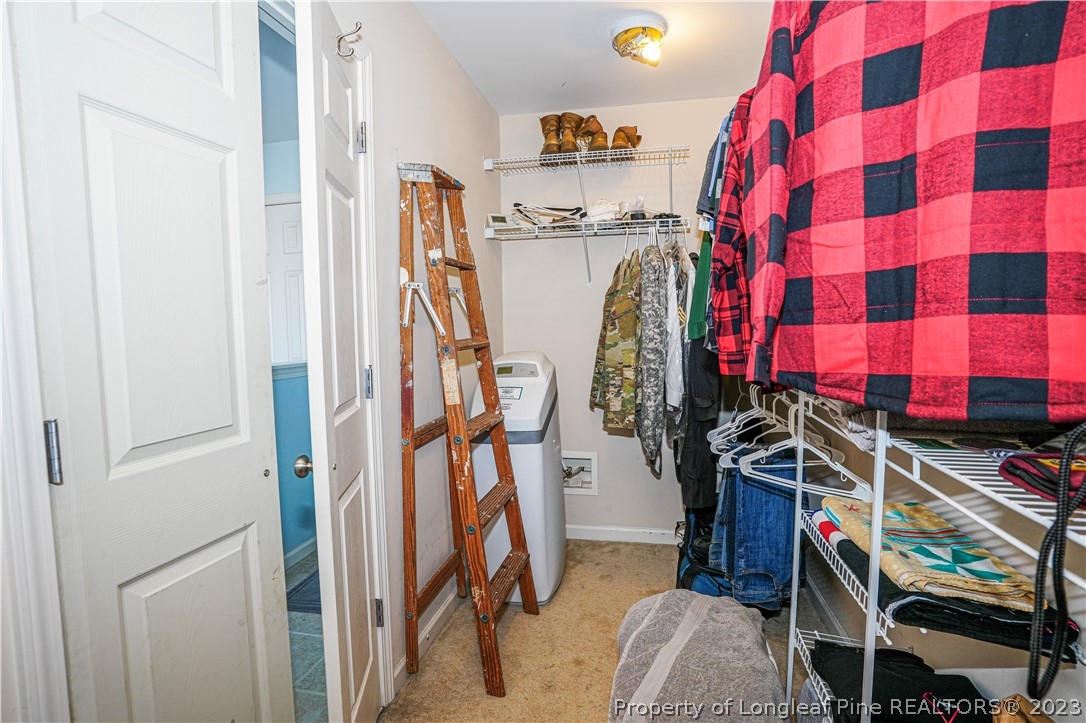 10 Pender Road Spring Lake, NC 28390 - Photo 12 of 30 a view of walk in closet with clothes