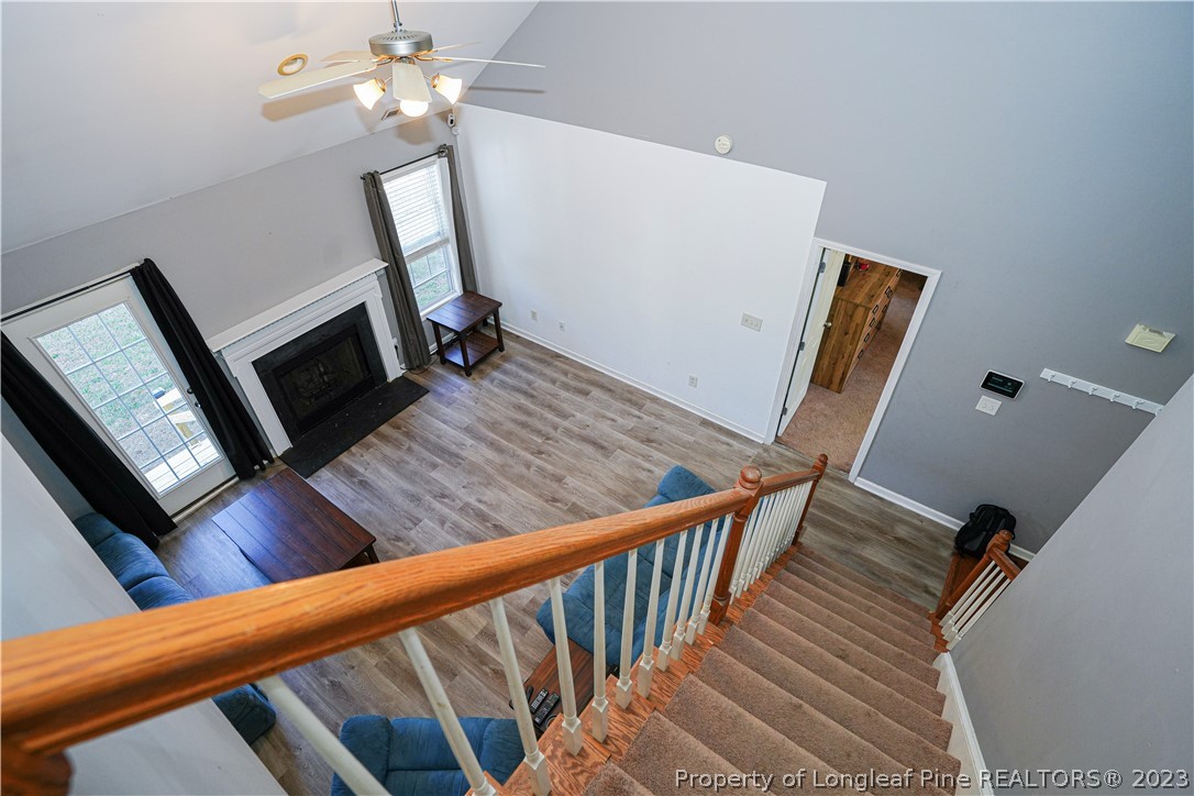 10 Pender Road Spring Lake, NC 28390 - Photo 16 of 30 a view of a hallway with wooden floor and staircase