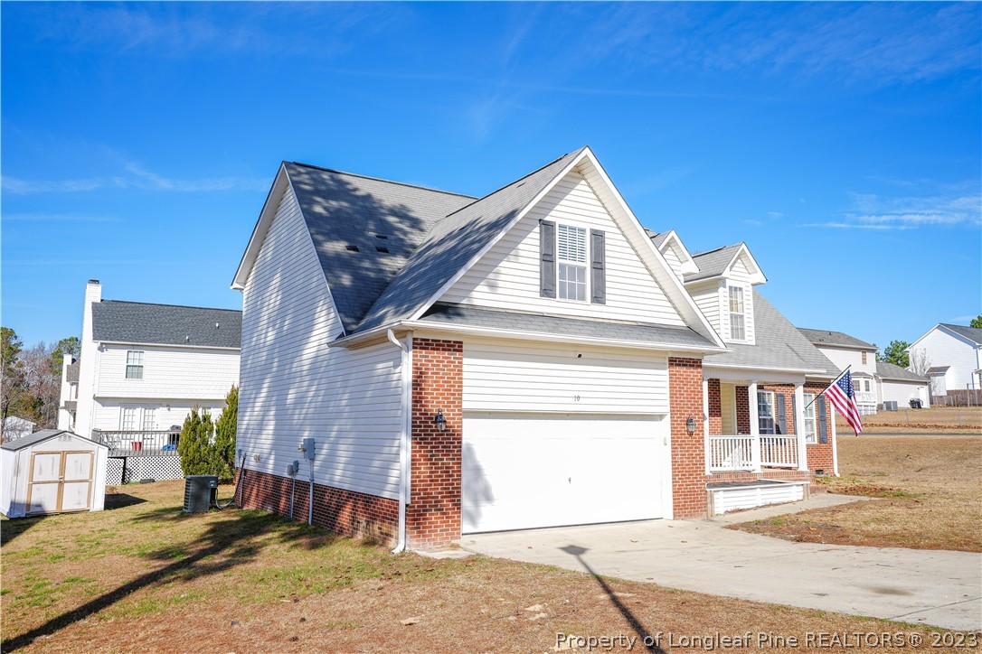 10 Pender Road Spring Lake, NC 28390 - Photo 2 of 30 a front view of a house with a yard