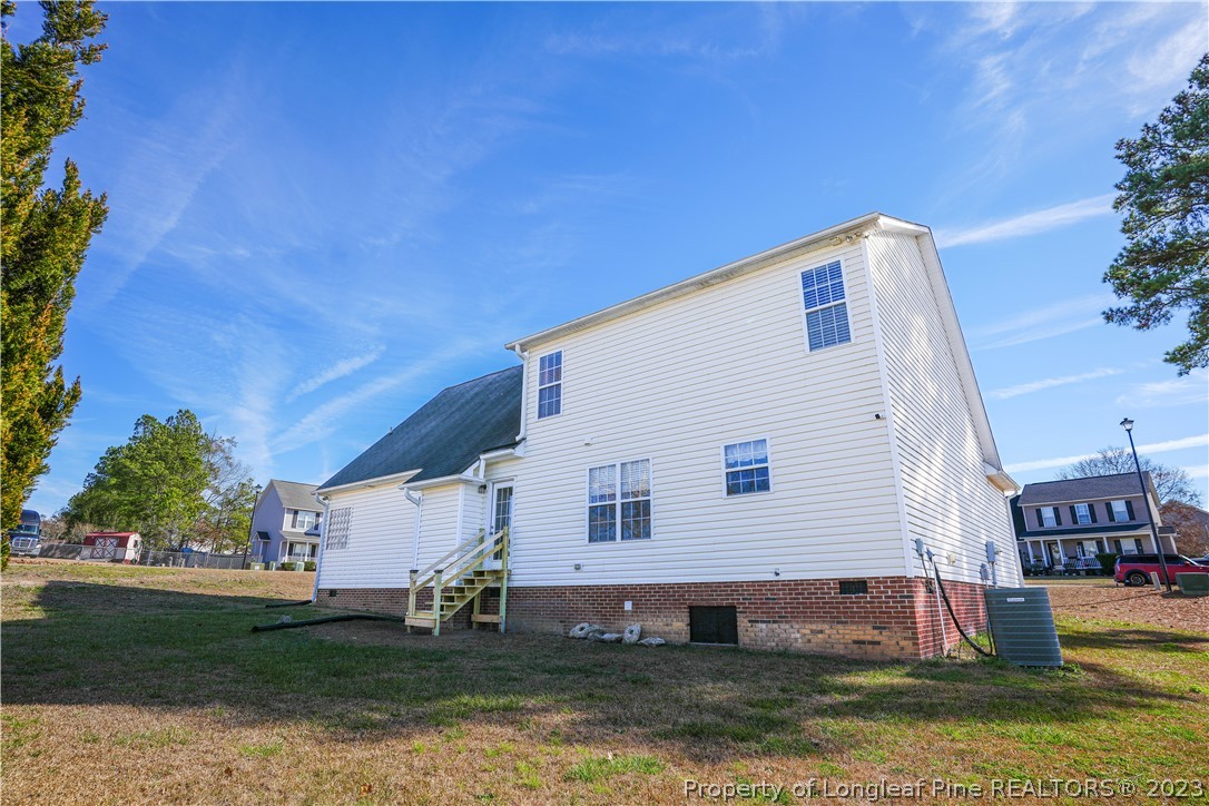 10 Pender Road Spring Lake, NC 28390 - Photo 30 of 30 a view of a house with a yard