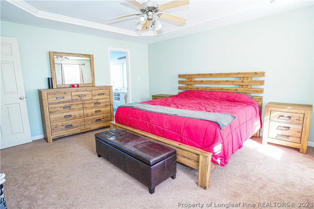 10 Pender Road Spring Lake, NC 28390 - Photo 8 of 30 a bedroom with a bed and a dresser