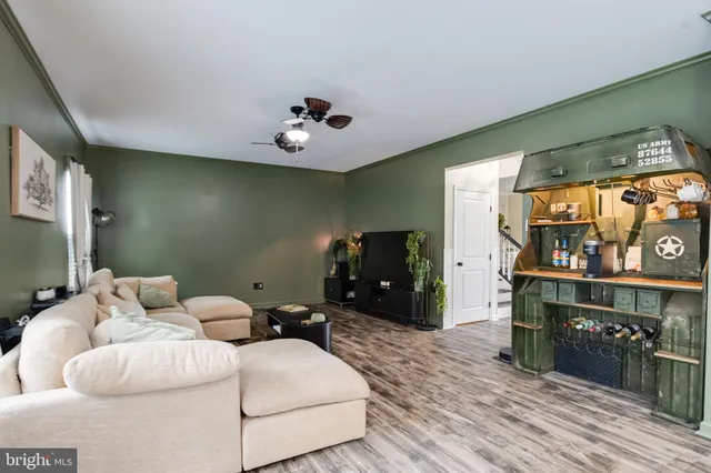 a bedroom with bed and wooden floor