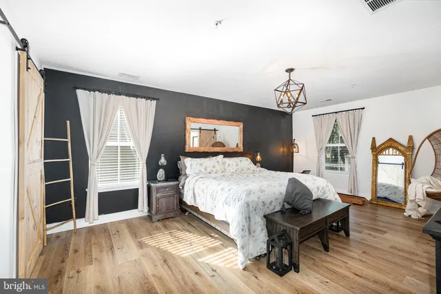 a bed room with a bed and a window