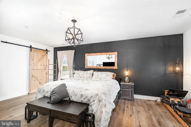 a bedroom with a bed and a table