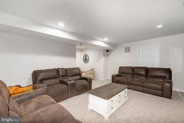 a living room with furniture and a couch