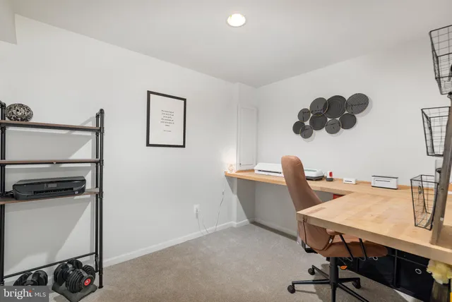 a view of a workspace with furniture