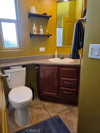 a bathroom with a toilet and a sink