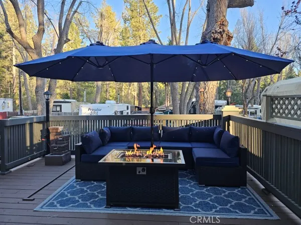 a view of a chairs and tables in the back yard
