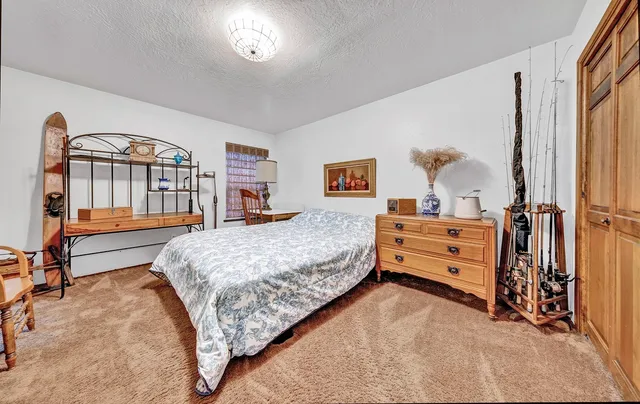 a view of a swimming pool with an outdoor seating and a yard