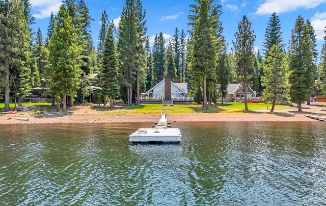 a view of a swimming pool with a bench