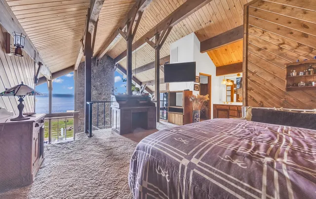 a view of a house with swimming pool and sitting area
