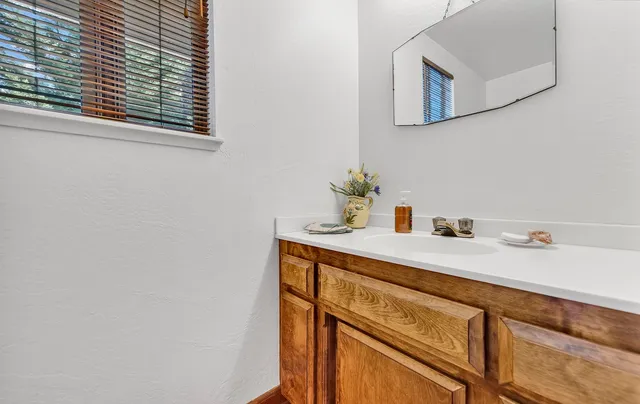 a view of a house with potted plants
