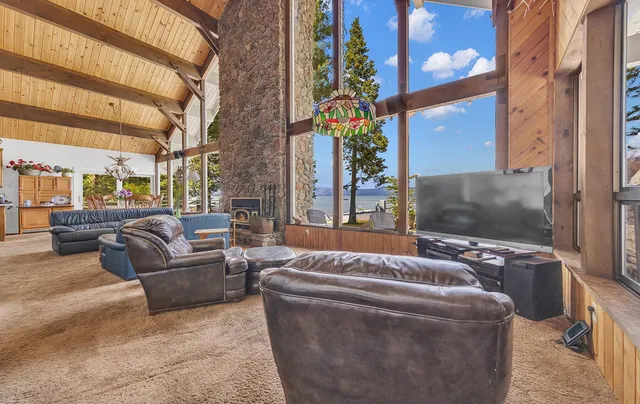 a view of an outside dining space with furniture window and outside view